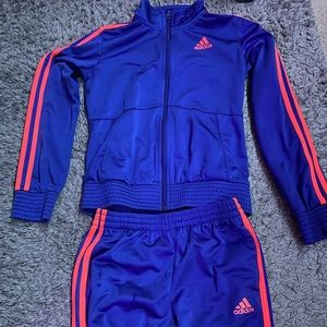 Blue and orange Adidas track suit